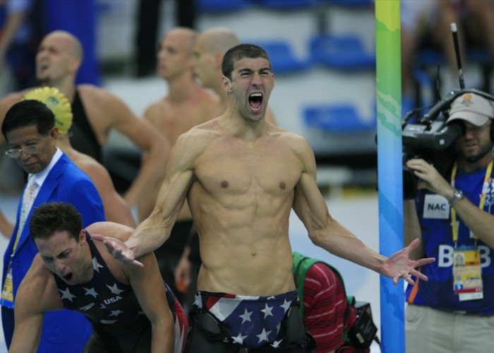 Michael Phelps, right, and Garrett Weber-Gale, both of the U.S., react after winning the men's 4X 100-meter freestyle relay swimming event on day three of the 2008 Beijing Olympics in Beijing, China, on Monday, Aug. 11, 2008.