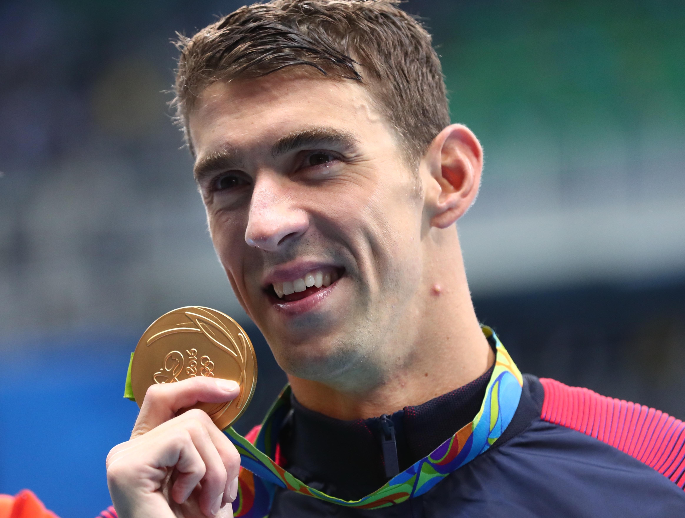The most medals. Michael Phelps USA.